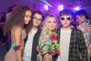 School students pose for a selfie at prom disco. 